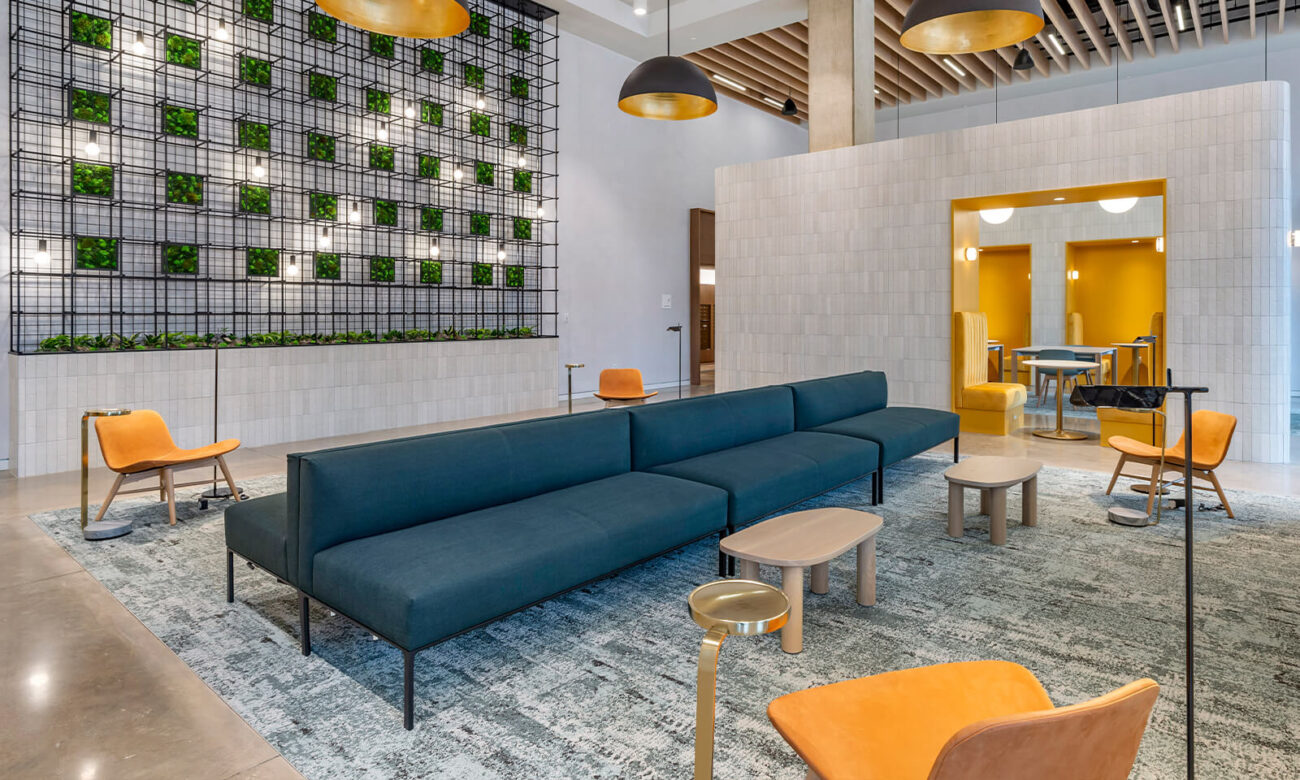 Seating/hang out/working areas in Otis, decorated in cool blues and warm golds.