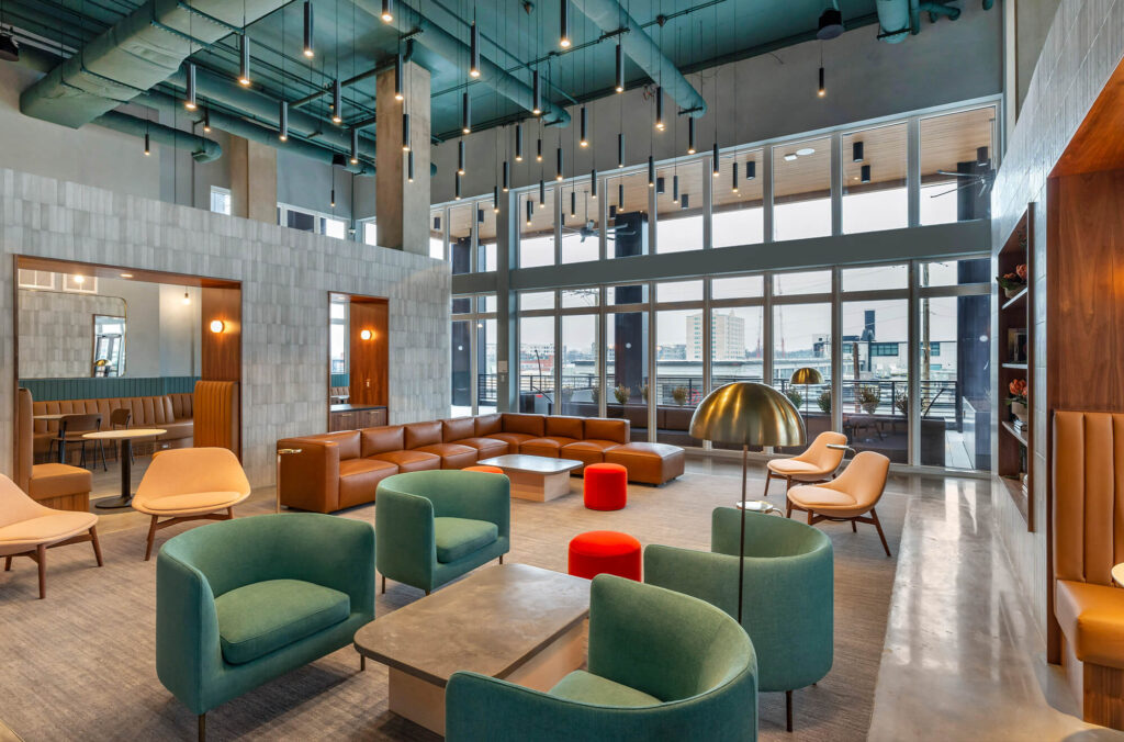 Beautiful seating area in Otis with outdoor balcony and view of the city.