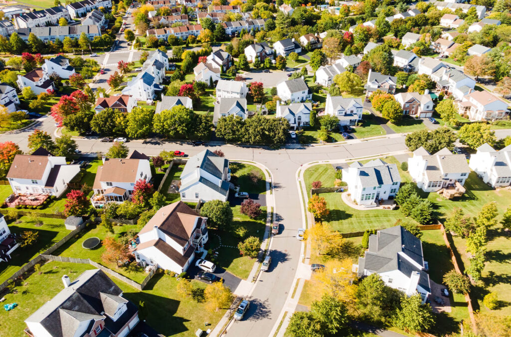 Aerial view of suburban neighborhood when the leaves are starting to change colors