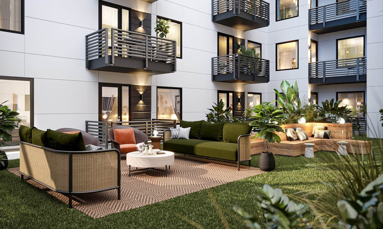 Main outdoor courtyard at VIV with turf flooring and lots of plants.